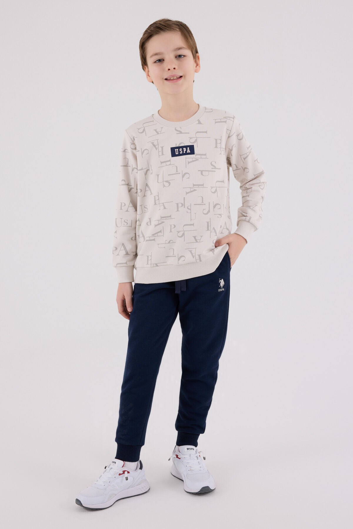 U.S. Polo Assn. Erkek Çocuk Bisiklet Yaka Pigment Baskılı Kışlık Regular Fit Krem Eşofman Takımı US2230-C-V2 Ürün ana görseli