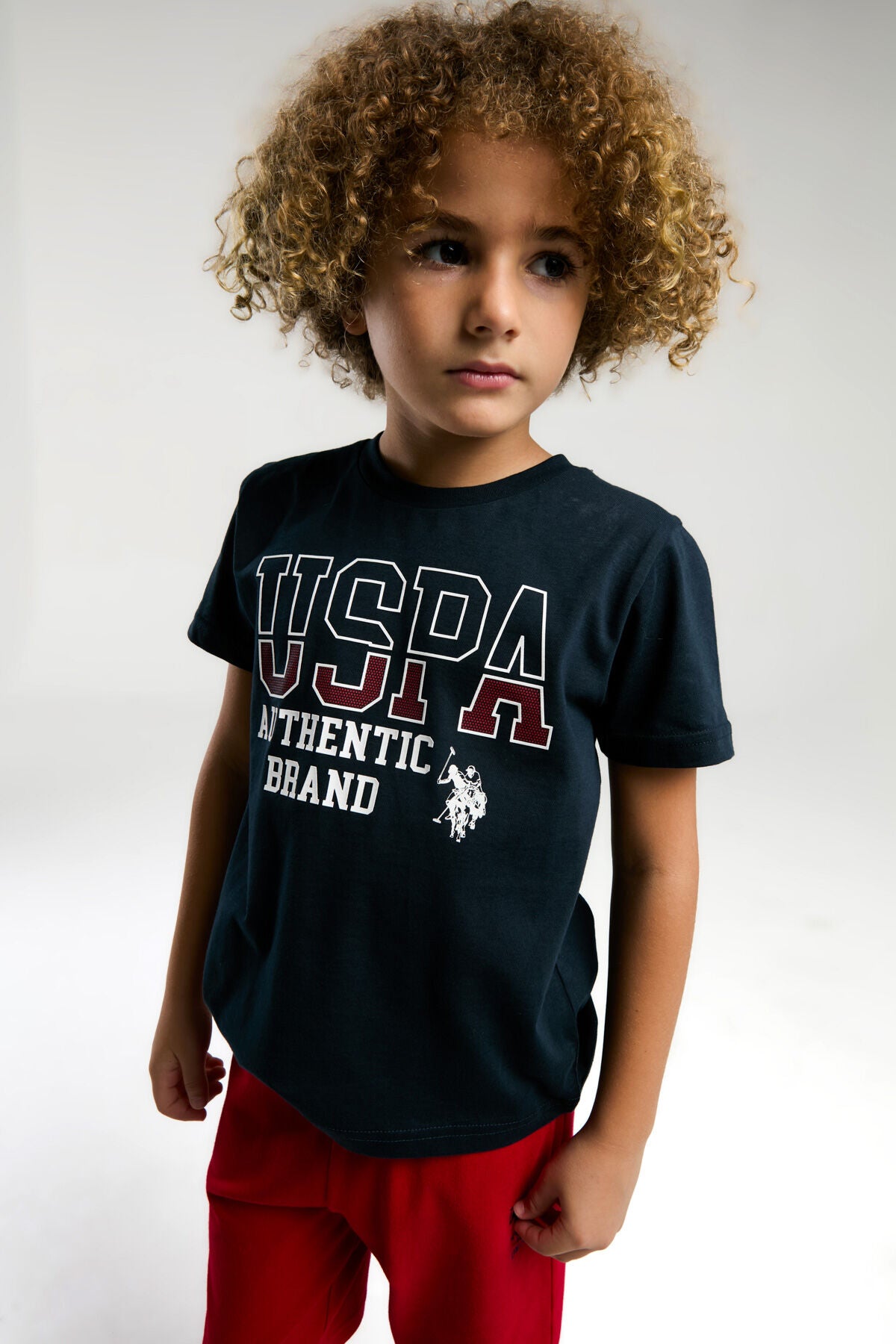 U.S. Polo Assn. Erkek Çocuk Bisiklet Yaka Pigment Baskılı Yazlık Regular Fit Lacivert Bermuda Takım US2009-C-V1 Ürün ana görseli