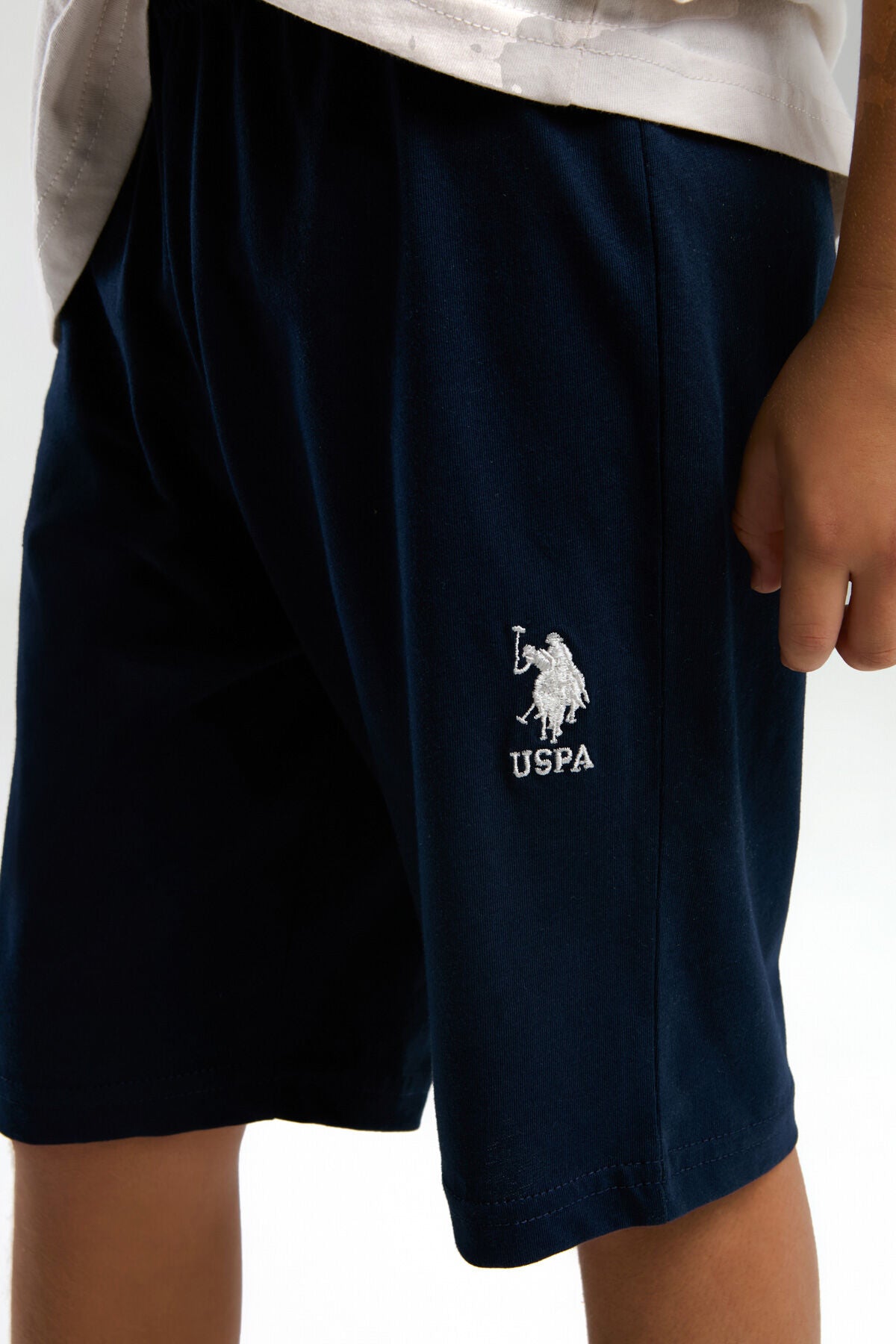 U.S. Polo Assn. Erkek Çocuk Bisiklet Yaka Pigment Baskılı Yazlık Regular Fit Krem Bermuda Takım US2024-C-V1