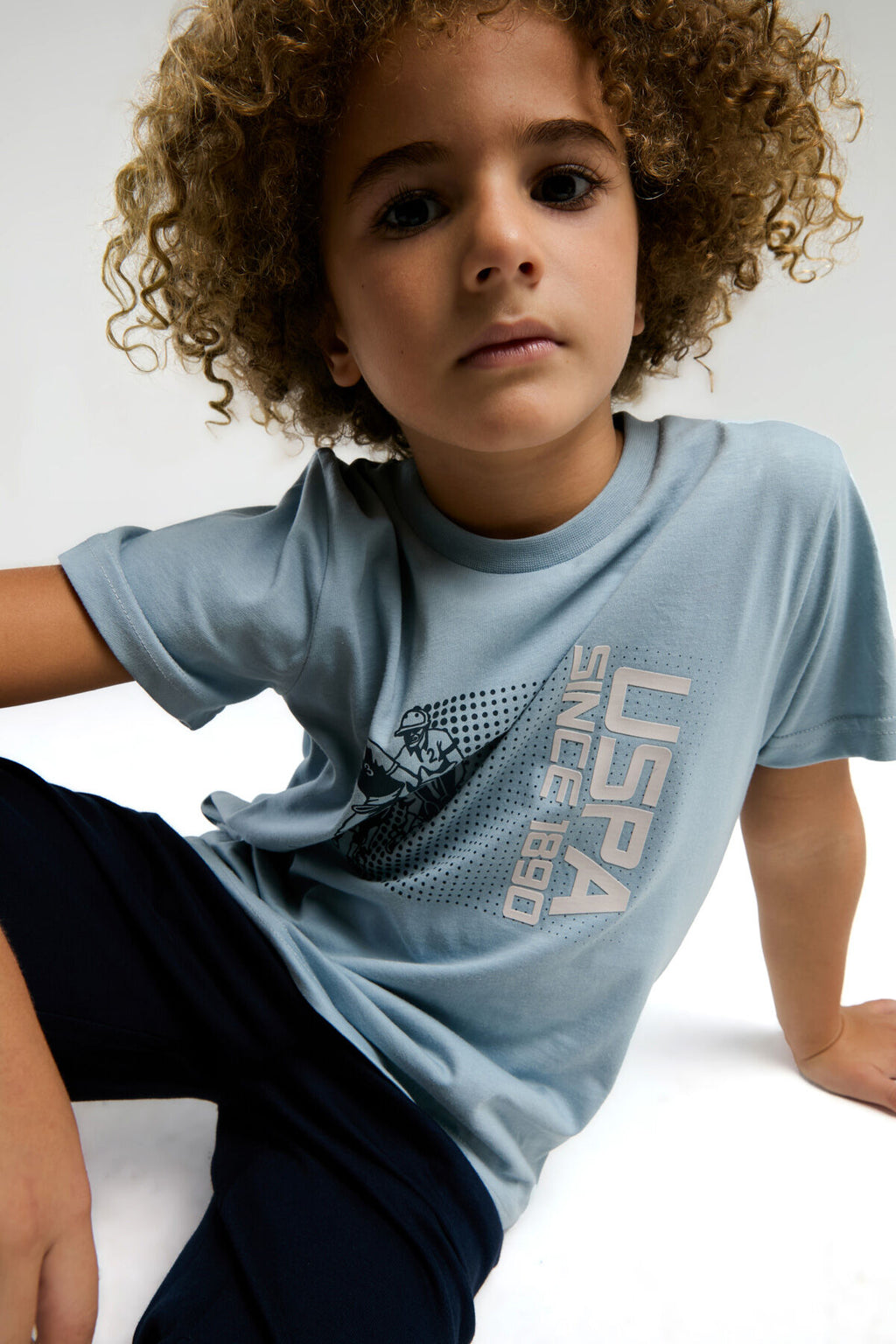 U.S. Polo Assn. Erkek Çocuk Bisiklet Yaka Pigment Baskılı Yazlık Regular Fit Mavi Bermuda Takım US2025-C-V1