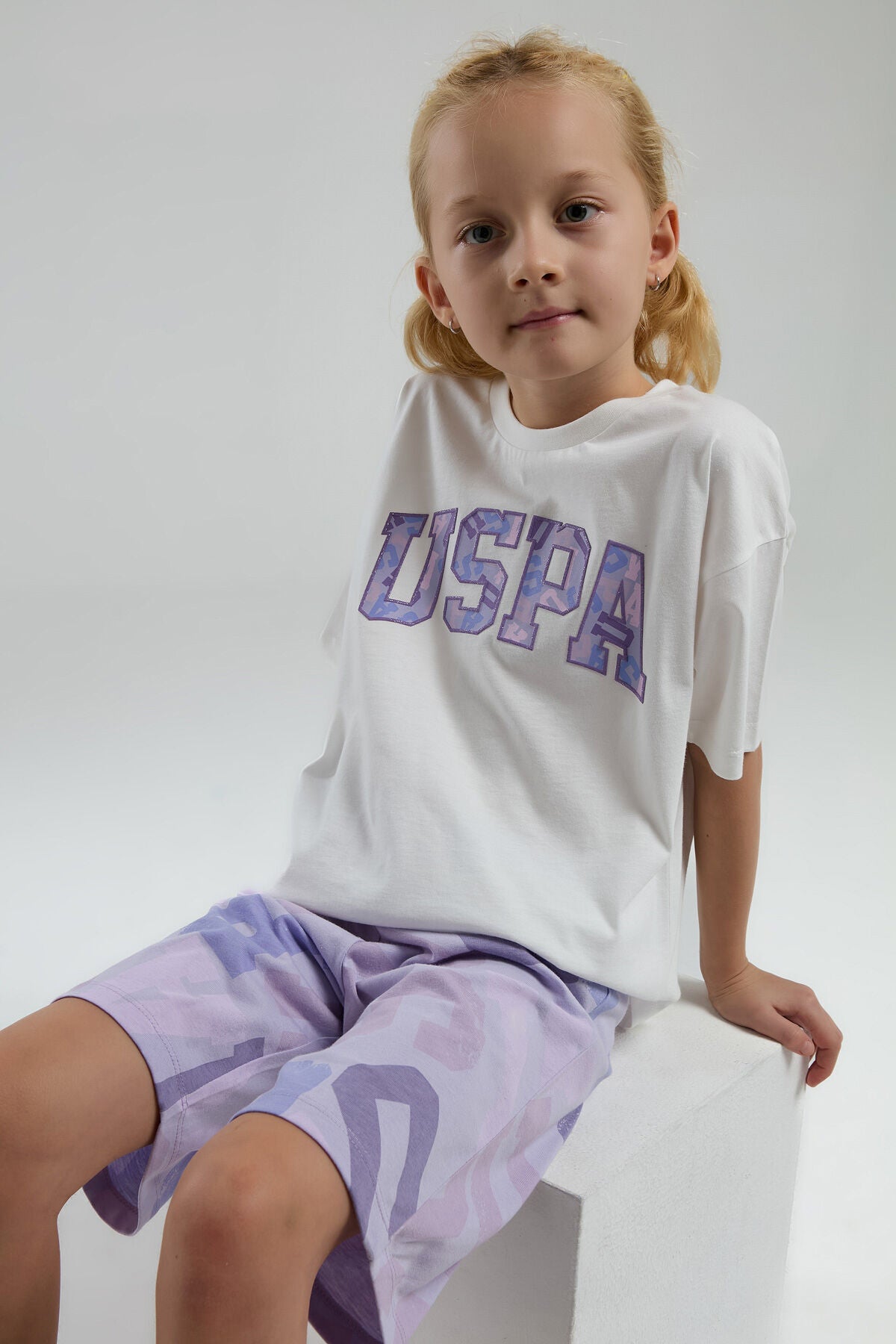 U.S. Polo Assn. Kız Çocuk Bisiklet Yaka Pigment Baskılı Yazlık Regular Fit Beyaz Bermuda Takım US2084-C-V1 Ürün ana görseli