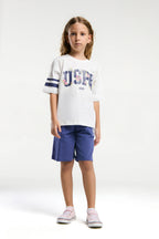 U.S. Polo Assn. Kız Çocuk Bisiklet Yaka Pigment Baskılı Yazlık Regular Fit Beyaz Bermuda Takım US2070-C-V2