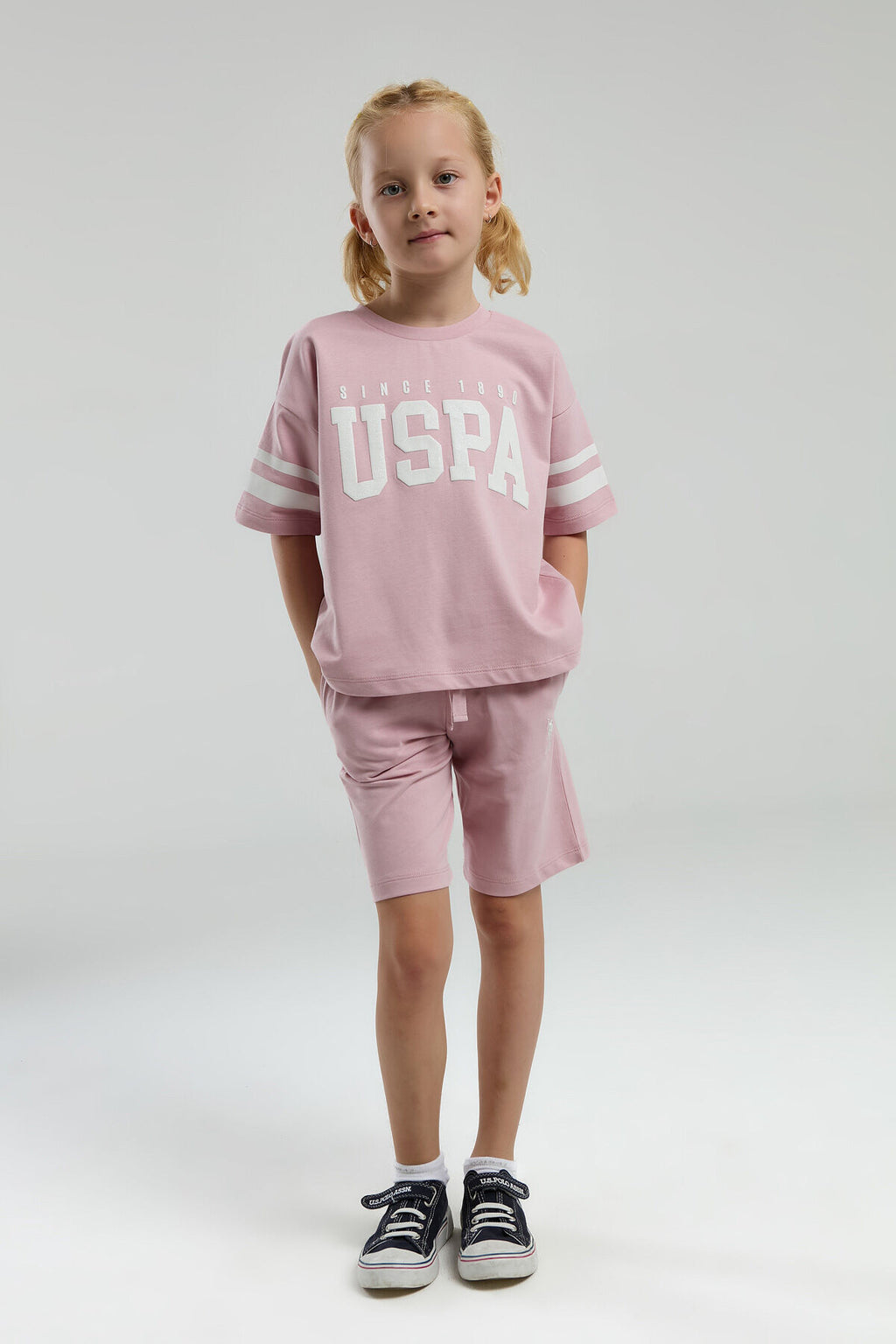 U.S. Polo Assn. Kız Çocuk Bisiklet Yaka Pigment Baskılı Yazlık Regular Fit Pembe Bermuda Takım US2091-C-V5