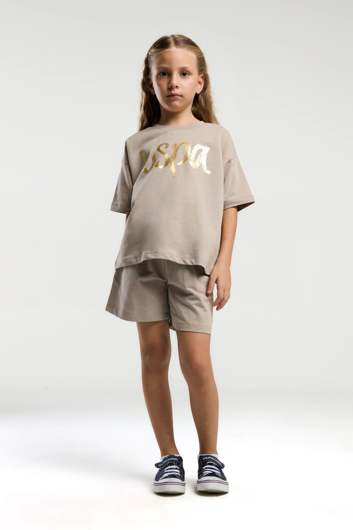 U.S. Polo Assn. Kız Çocuk Bisiklet Yaka Pigment Baskılı Yazlık Regular Fit Krem Şort Takım US2082-C-V1 Ürün ana görseli