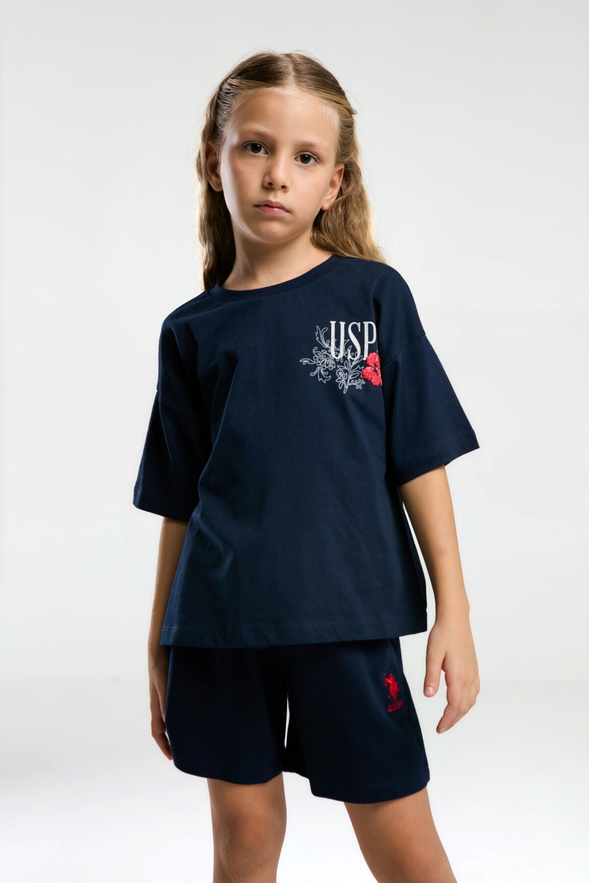 U.S. Polo Assn. Kız Çocuk Bisiklet Yaka Pigment Baskılı Yazlık Regular Fit Lacivert Şort Takım US2072-C-V1