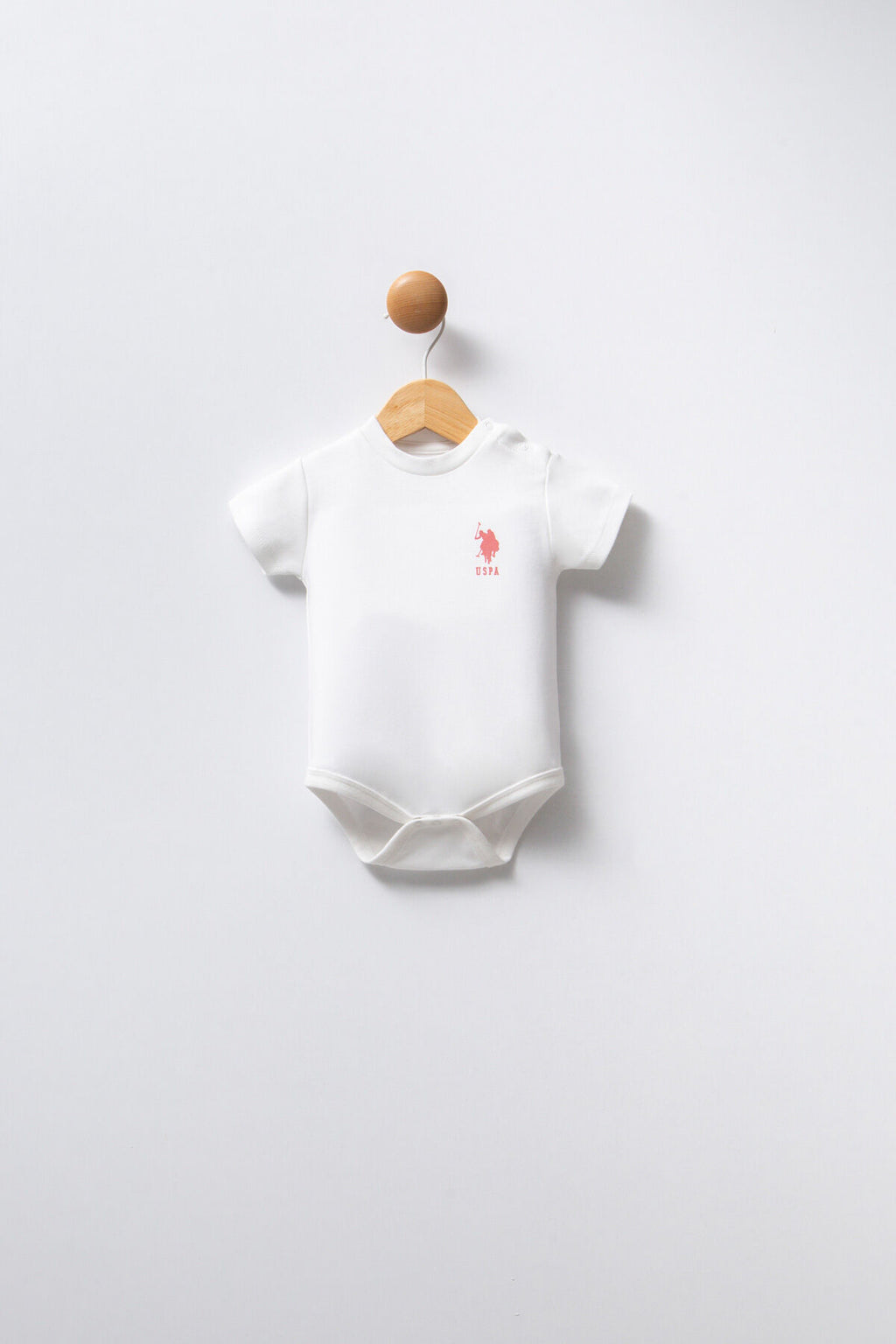 U.S. Polo Assn. Kız Bebek Bisiklet Yaka Pigment Baskılı Yazlık Regular Fit Pembe Badi Zıbın USB2353-C-V1