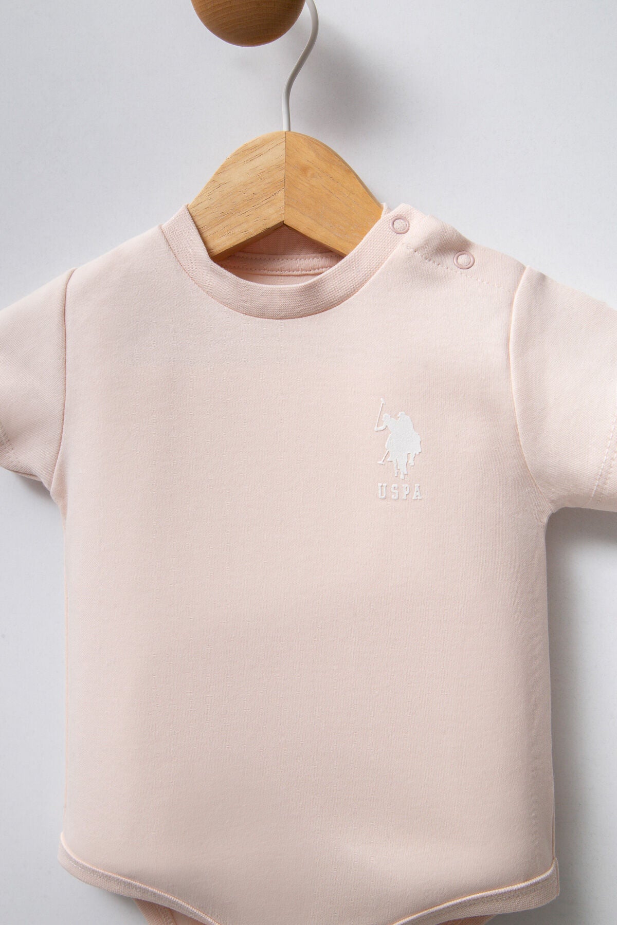 U.S. Polo Assn. Kız Bebek Bisiklet Yaka Pigment Baskılı Yazlık Regular Fit Pembe Badi Zıbın USB2353-C-V1