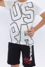 U.S. Polo Assn. Erkek Çocuk Bisiklet Yaka Pigment Baskılı Yazlık Regular Fit Krem Bermuda Takım US1090-C-V-1