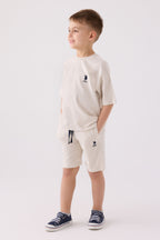 U.S. Polo Assn. Erkek Çocuk Bisiklet Yaka Pigment Baskılı Yazlık Regular Fit Krem Bermuda Takım US1780-C-V2