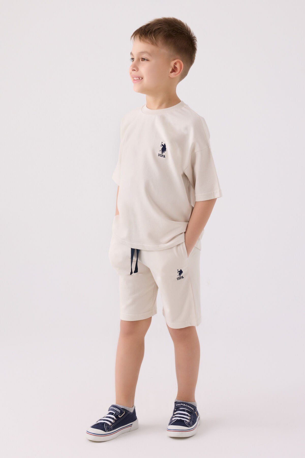 U.S. Polo Assn. Erkek Çocuk Bisiklet Yaka Pigment Baskılı Yazlık Regular Fit Krem Bermuda Takım US1780-C-V2