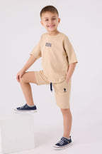 U.S. Polo Assn. Erkek Çocuk Bisiklet Yaka Pigment Baskılı Yazlık Regular Fit Krem Bermuda Takım US1781-C-V12