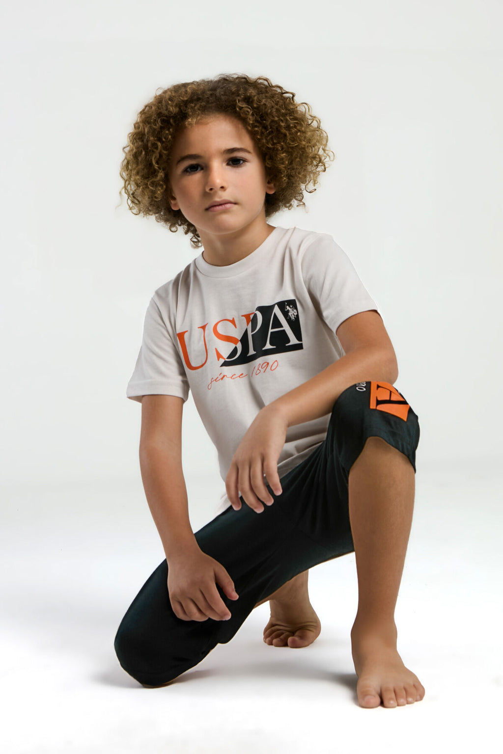 U.S. Polo Assn. Erkek Çocuk Bisiklet Yaka Pigment Baskılı Yazlık Regular Fit Krem Kapri Takım US2030-C-V1