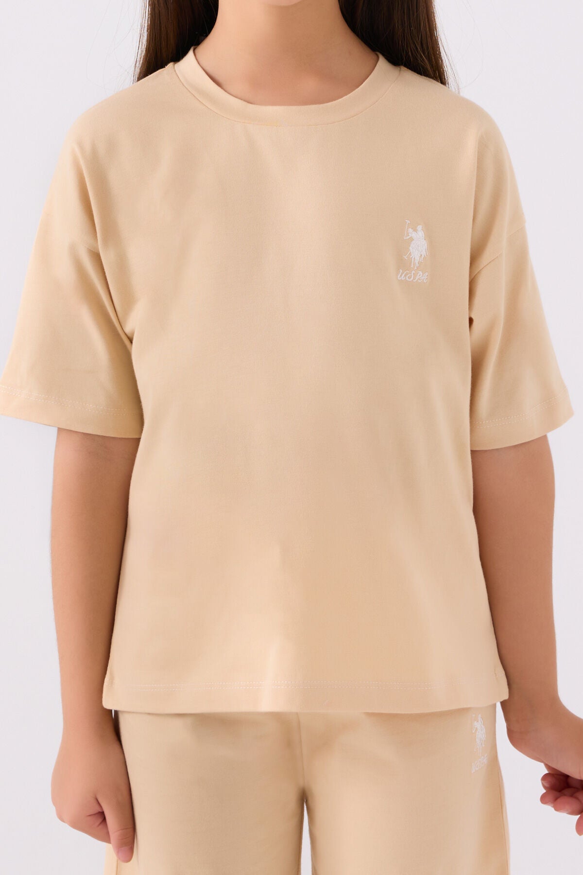 U.S. Polo Assn. Kız Çocuk Bisiklet Yaka Sargı Nakışlı Yazlık Regular Fit Krem Bermuda Takım US1848-C-V57