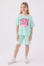 U.S. Polo Assn. Kız Çocuk Bisiklet Yaka Pigment Baskılı Yazlık Regular Fit Mavi Bermuda Takım US1849-C-V2